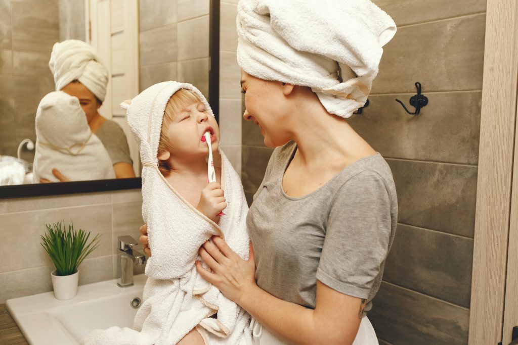 Teaching Kids to Brush Can Be Fun and Effective 6 mom teaches little son brush his teeth