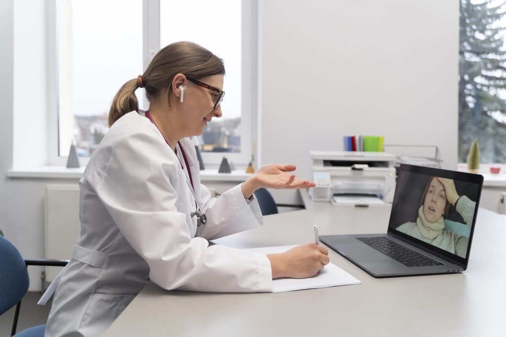 doctor teleconsulting patient laptop